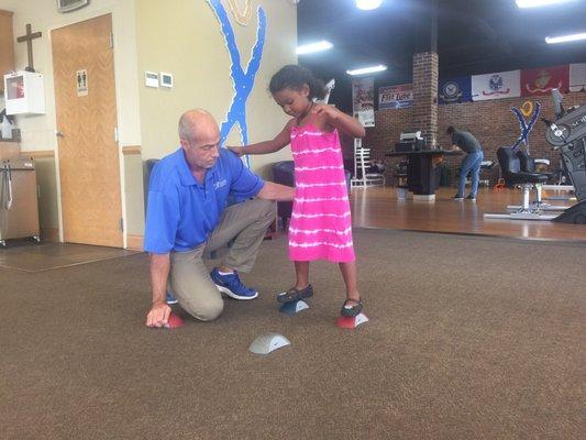 Mr. Hayden working with my daughter on strengthening her knee.