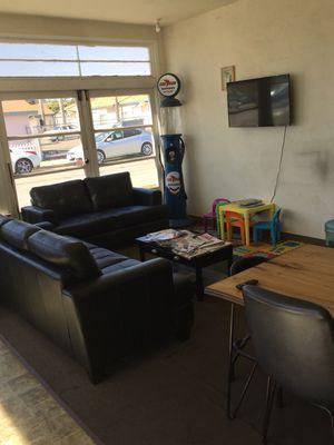 Nice couches and tv in waiting room