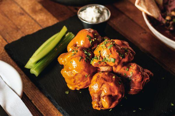 buffalo cauliflower wings  served with house made blue cheese sauce.