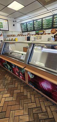 The employee covered the glass so that what he was going to order could not be seen.  First time he went through this at a Subway.