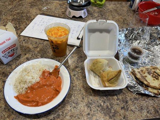 Butter chicken came with rice. Veggie samosas, garlic naan and Mango Lassi