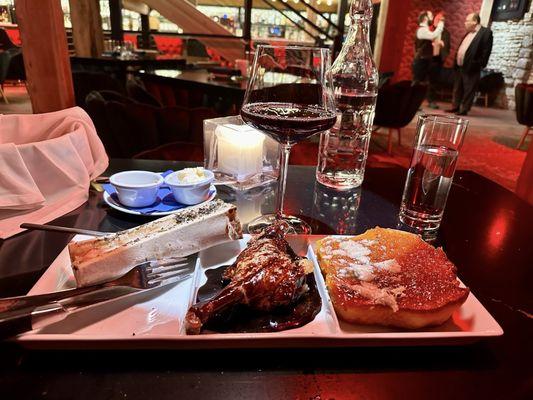 Bone Marrow & Duck Confit dish. The duck confit leg, coated in a luscious chocolate glacée,