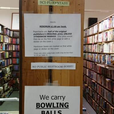 Pricing information and view of two aisles of books.