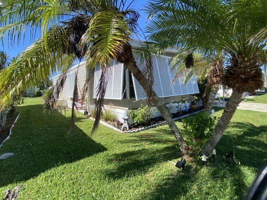 View of front and side new Bahama Shutters.