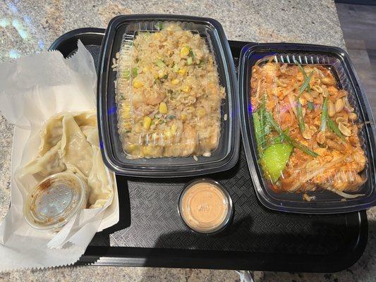 Packaging in black containers with clear plastic lids at Midtown Noodles & Grill