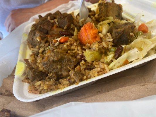 Curry Goat, Rice and peas and steamed vegetables