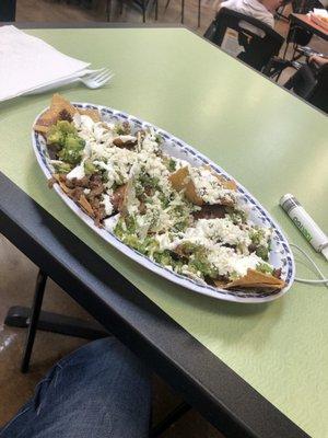 Nachos with asada, queso, creams, guacamole and frijoles....DELICIOUS!!