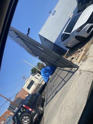 Homeless tents right in front of the business.