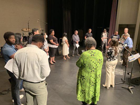 Sunday morning team prays before service at the JCC in Palo Alto.