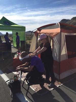 Doing chair massage at Triple Dare Run at Ed Rocks