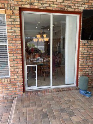 Custom pet door in the sliding door glass!