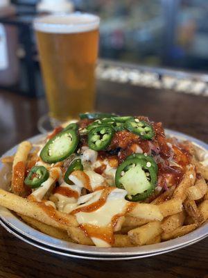 Doc's Bama Fries...fries piled with pulled pork, cheese sauce, jalapeños and Memphis sauce. $13.