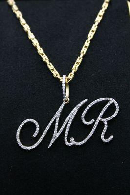 Custom diamond name pendants.