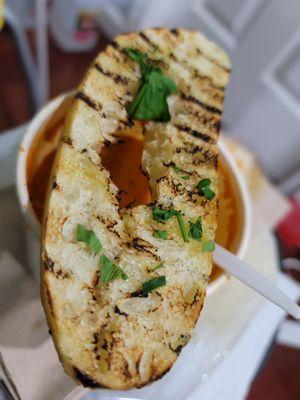 Grilled slice of bread with olive oil and parsley, came with soup and every entree. Just meh.