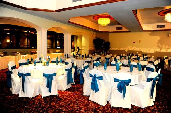 The left side of the 3rd floor party hall showing tables set up and a glimpse of the glass room.