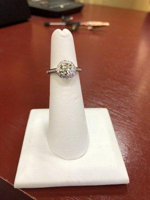 custom made 14k white gold ring set with customer's diamond in center.