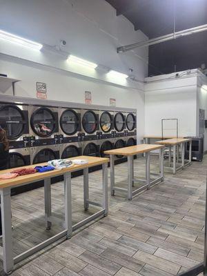 Clean tables to fold clothes on. The dryers are 0.25 per 7 minutes, $1 for 28 minutes.