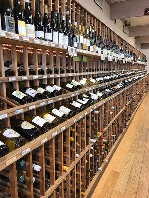 A view down our wine room wall where our selections of domestic and french wines live!