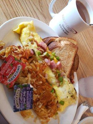 Country omelet with hashbrowns, well done, and wheat toast.