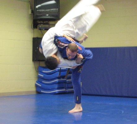 Brian executes a harai goshi hip throw.