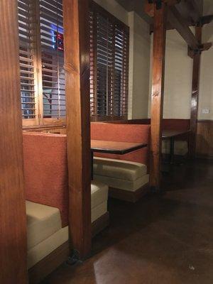 Dining area with TV and fireplace and booths