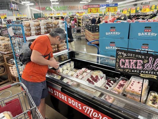 My hubby going bonkers over the cake section!