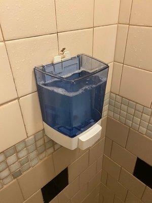 Soap dispenser don't work so someone turned it into self service by popping the top of.