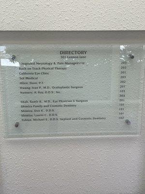 Up close of building directory at front entrance of building