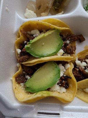 Two of the tripe mini-tacos. Check out the avocado slices.