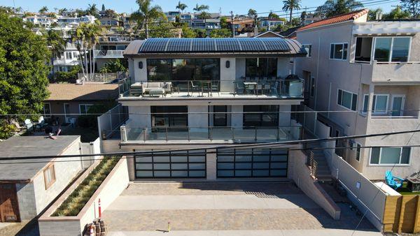 Solar on metal roof and battery inside garage of new home in Encinitas