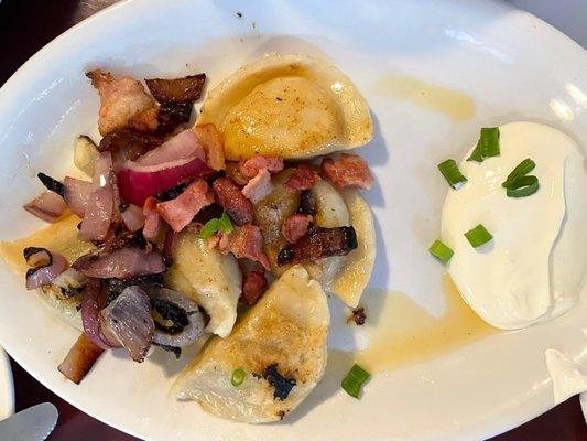 Pierogis and sour cream