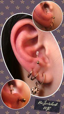 Fresh - Anti Tragus Piercing. Pierced with: 14k Gold micro Curved Barbell w/ Marquise CZ.