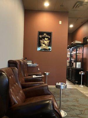 Cigar Town Herndon lounge. Seats that look like recliners against the wall.