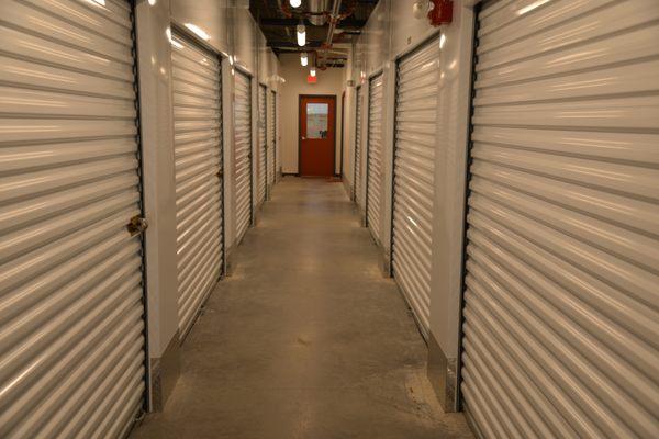 Wide hallways with motion-sensor lighting.