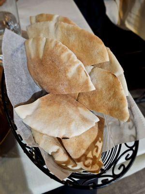 Pita bread basket served with meal.