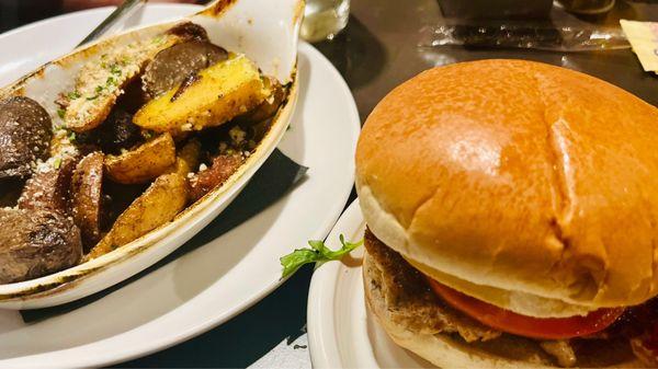 Blackened salmon burger with avocado-lime aioli on the side  of truffle roasted potatoes