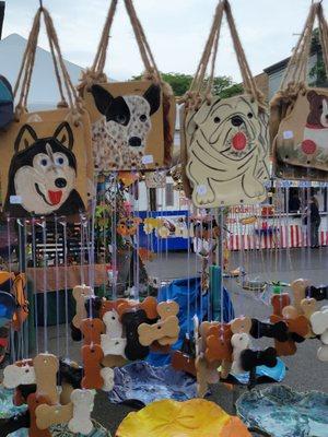 Local vendor selling, among other things, handmade doggie windchimes.