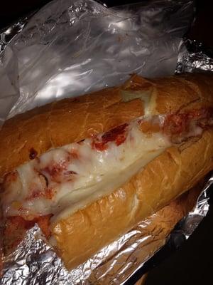 Meatball hoagie with cheese.