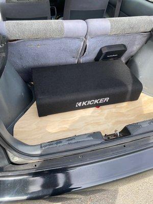 2 12" kicker down firing sub enclosure with Rockville amp.