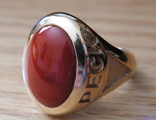 Peck's designed this 18k yellow gold gents ring using Natural Oxblood Coral, weighing almost 1 troy ounce!