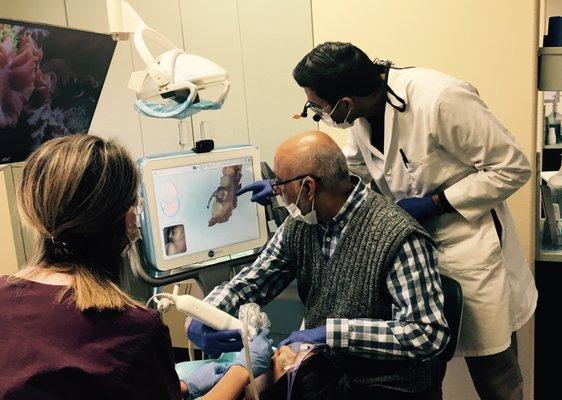 Dr. Bijal & Dr. Ashok, working side-by side with our new Itero scanner.