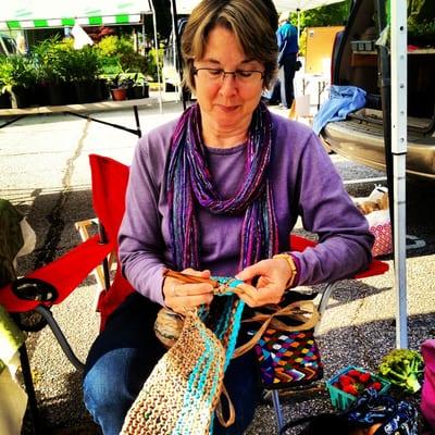 Donna Walker crocheting a tote from recycled plastic bags.