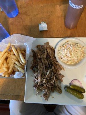 Pulled Pork platter with Fries, Cole slaw and baby pickles/onion.