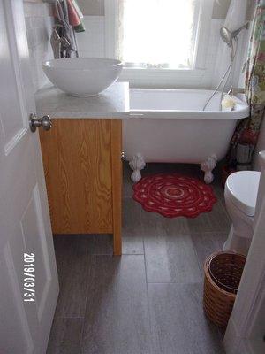 Bathroom Floor with same tile.