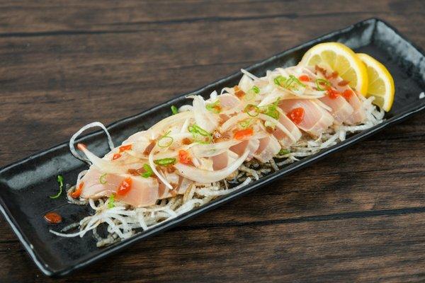 Savor the exquisite flavors of our Tuna Tataki: seared tuna with zesty citrus soy. A culinary delight that will leave you wanting more!