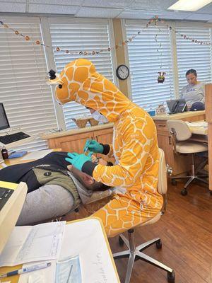 Dr. Cruz in his giraffe for the 2022 Halloween!