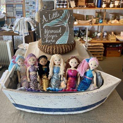 Mermaids in a boat