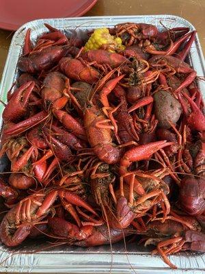 Tray of crawfish with corn and potatoes