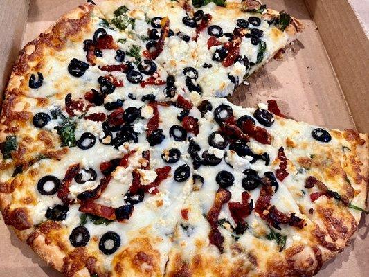 Medium pizza with olive oil, sundried tomatoes, spinach, blk. olives, feta & mozzarella. SOOOO good!!