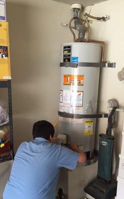 Our tech Bernardo performing a repair on a 50 gallon Bradford White water heater.